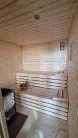 Kulturtau Sauna 2 m x 2 m mit holzbefeuerter Harvia M3 Ofen, Montage vor Ort